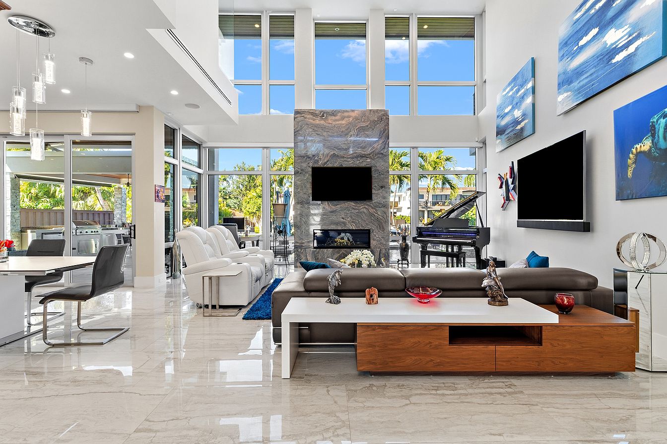 Double-height living room and floor-to-ceiling glass at the mansion