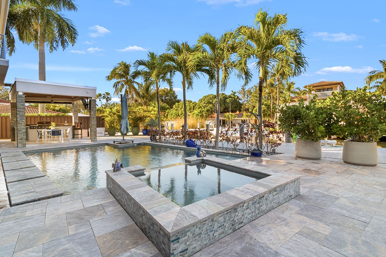 Pool, spa and waterfront terrace at our event mansion